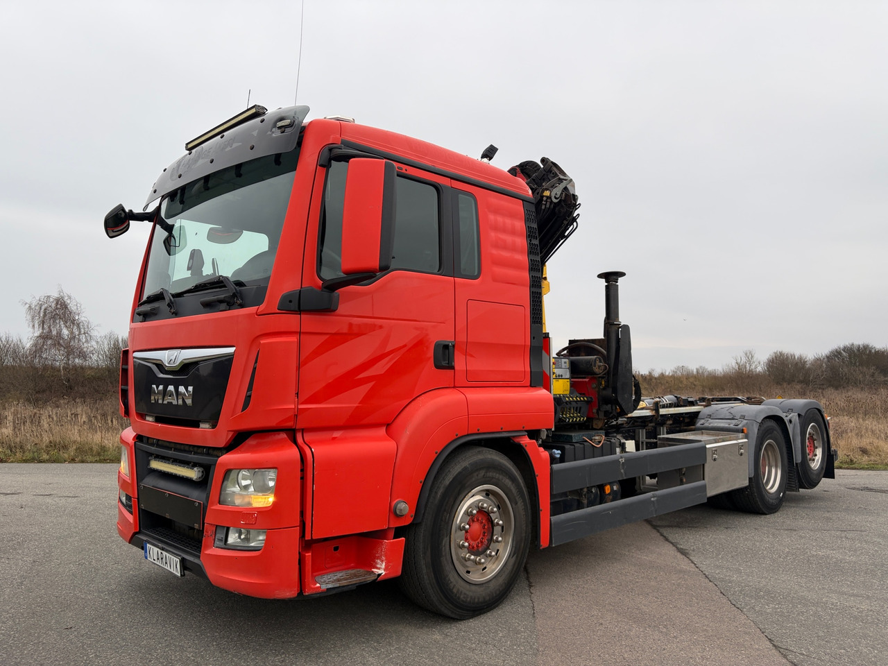 MAN TGS 26.480 - Ciężarówka hakowiec: zdjęcie 1 MAN TGS 26.480 - Ciężarówka hakowiec: zdjęcie 1
