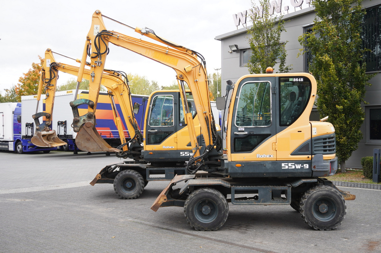 Hyundai Robex 55W-9 Wheeled Excavator 5.5t / 2pcs - Minikoparka: zdjęcie 1 Hyundai Robex 55W-9 Wheeled Excavator 5.5t / 2pcs - Minikoparka: zdjęcie 1