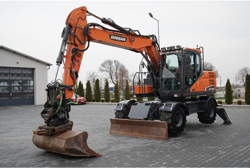 Doosan DX 140W - Koparka kołowa: zdjęcie 1 Doosan DX 140W - Koparka kołowa: zdjęcie 1